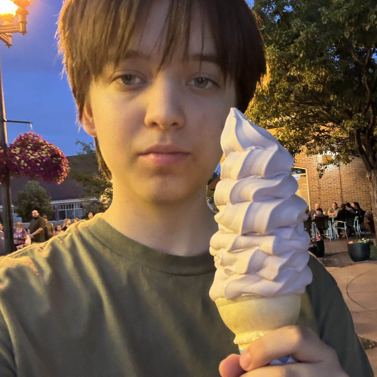 student holding ice cream cone